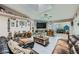 Cozy living room with a stone fireplace, ceiling fan, and skylight at 6616 Celeste Ave, Las Vegas, NV 89107