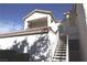 Exterior view of the condo featuring stair access to the second level at 75 N Valle Verde Dr # 225, Henderson, NV 89074