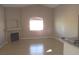 Open-concept living room featuring a decorative fireplace and plenty of natural light at 75 N Valle Verde Dr # 225, Henderson, NV 89074