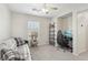 Bedroom with ceiling fan, carpeted floor and desk area at 7640 Woven Memories St, Las Vegas, NV 89149