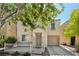 Charming two-story home featuring a covered front porch and a one-car garage at 7640 Woven Memories St, Las Vegas, NV 89149
