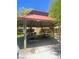 Neighborhood park features a shaded gazebo with picnic tables, providing an inviting place for outdoor gatherings at 7640 Woven Memories St, Las Vegas, NV 89149