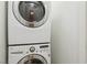 Laundry closet with stacked washer and dryer at 7640 Woven Memories St, Las Vegas, NV 89149