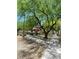 Community park features lush trees and a picnic area for outdoor gatherings and leisurely enjoyment at 7640 Woven Memories St, Las Vegas, NV 89149