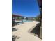 Community pool features chaise lounges for relaxing and ample space for lounging by the water at 7640 Woven Memories St, Las Vegas, NV 89149