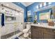 Stylish bathroom featuring a marble-tiled shower with a glass door and a vanity with modern fixtures at 830 Carnegie St # 512, Henderson, NV 89052
