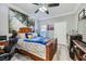 Comfortable bedroom featuring neutral walls, a wooden bed frame, and an organized workspace at 830 Carnegie St # 512, Henderson, NV 89052