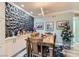 Elegant dining room with stylish decor, a modern light fixture, and a decorative wall panel at 830 Carnegie St # 512, Henderson, NV 89052