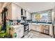 Modern kitchen featuring stainless steel appliances, white cabinets, and a stylish backsplash with natural light at 830 Carnegie St # 512, Henderson, NV 89052
