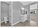 Well-lit bathroom with a toilet and a vanity, showcasing a clean and modern design at 851 Klamath Springs St, Henderson, NV 89011