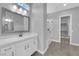 Bathroom featuring a large mirror, sleek vanity, and a glass-enclosed shower at 851 Klamath Springs St, Henderson, NV 89011
