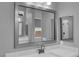 Close-up of bathroom vanity featuring a modern faucet, bright lighting, and ample counter space at 851 Klamath Springs St, Henderson, NV 89011
