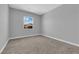 Carpeted bedroom showcasing neutral tones, a bright window, and a serene atmosphere at 851 Klamath Springs St, Henderson, NV 89011