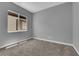 A simple bedroom includes a window with natural light and a neutral carpet at 851 Klamath Springs St, Henderson, NV 89011