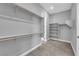 Walk-in closet with shelving and rods, providing ample storage space at 851 Klamath Springs St, Henderson, NV 89011