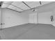 This large garage features a sealed concrete floor and white walls at 851 Klamath Springs St, Henderson, NV 89011