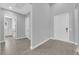 Hallway has tile flooring and neutral paint with access to rooms and closets at 851 Klamath Springs St, Henderson, NV 89011