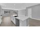 Open concept kitchen showcases a spacious island with sleek appliances and modern finishes at 851 Klamath Springs St, Henderson, NV 89011