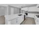 Bright kitchen features white cabinetry, stainless appliances, and a large center island at 851 Klamath Springs St, Henderson, NV 89011