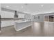 Modern kitchen features white cabinets, stainless steel appliances, and a spacious island at 851 Klamath Springs St, Henderson, NV 89011