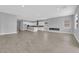 Spacious living room with modern fireplace and open floor plan to the kitchen at 851 Klamath Springs St, Henderson, NV 89011