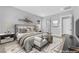 Staged main bedroom with stylish decor, a large bed, and a neutral color palette at 851 Klamath Springs St, Henderson, NV 89011