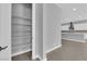 Walk-in pantry providing ample storage adjacent to the open kitchen and living space at 851 Klamath Springs St, Henderson, NV 89011