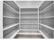 Large, well-organized walk-in pantry with white shelving offers ample storage space at 851 Klamath Springs St, Henderson, NV 89011