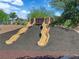 Community playground featuring two slides for a fun time for all at 851 Klamath Springs St, Henderson, NV 89011