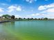 Scenic pond view with blue sky and trees, perfect for relaxing walks and enjoying nature at 851 Klamath Springs St, Henderson, NV 89011