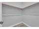 A walk-in closet features a clothes rod and carpet flooring at 851 Klamath Springs St, Henderson, NV 89011