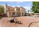 Spacious backyard with pool, brick patio, and ample space for outdoor entertaining at 8605 Trianon Ln, Las Vegas, NV 89145