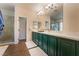 Bathroom with double vanity, large mirror, and walk-in shower at 8605 Trianon Ln, Las Vegas, NV 89145