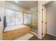 Bathroom boasts a soaking tub, glass-enclosed shower, and a large window at 8605 Trianon Ln, Las Vegas, NV 89145