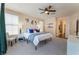 Neutral primary bedroom featuring a ceiling fan, and ensuite bath at 8605 Trianon Ln, Las Vegas, NV 89145