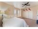 This comfortable bedroom features a ceiling fan, dual closets and sunny windows at 8605 Trianon Ln, Las Vegas, NV 89145