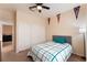 Comfortable bedroom with a ceiling fan, plenty of closet space, and neutral décor at 8605 Trianon Ln, Las Vegas, NV 89145