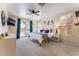 Large primary bedroom with access to an outdoor patio and tv at 8605 Trianon Ln, Las Vegas, NV 89145