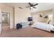 Spacious bedroom features a cozy sitting area and neutral color palette at 8605 Trianon Ln, Las Vegas, NV 89145