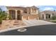 Stunning two-story home featuring a three-car garage, inviting entrance, and manicured front yard at 8605 Trianon Ln, Las Vegas, NV 89145