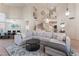 Spacious living room boasts high ceilings, spiral staircase, and a large sectional couch at 8605 Trianon Ln, Las Vegas, NV 89145