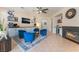 Inviting sitting room features blue armchairs, a fireplace, and a built-in bar area at 8605 Trianon Ln, Las Vegas, NV 89145