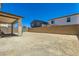 View of backyard offering open space for various outdoor activities, complemented by a block wall for added privacy at 9440 Lunar Ray St, Las Vegas, NV 89143