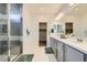 Bright bathroom featuring double sinks, a glass shower, and neutral colors at 9440 Lunar Ray St, Las Vegas, NV 89143