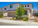 Charming two-story home featuring landscaped front yard and a two-car garage at 9440 Lunar Ray St, Las Vegas, NV 89143