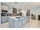 Stylish kitchen featuring a large island, modern appliances, and sleek gray cabinetry at 9440 Lunar Ray St, Las Vegas, NV 89143
