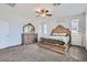 Comfortable bedroom with carpet, ceiling fan, stylish bed frame, and matching dresser with a mirror at 9440 Lunar Ray St, Las Vegas, NV 89143