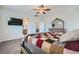 Beautiful carpeted main bedroom with a bed and dresser, offering a view into the attached bathroom at 9440 Lunar Ray St, Las Vegas, NV 89143