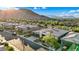 A neighborhood with a view of the mountains with modern homes, solar panels, and well-maintained landscaping at 9972 Terrastone Dr, Las Vegas, NV 89148