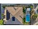 This home boasts an immaculate backyard oasis with a pool, spa, fire pit, and outdoor kitchen at 9972 Terrastone Dr, Las Vegas, NV 89148